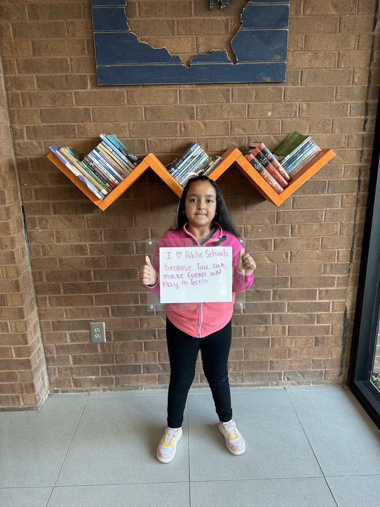 girl holding white board