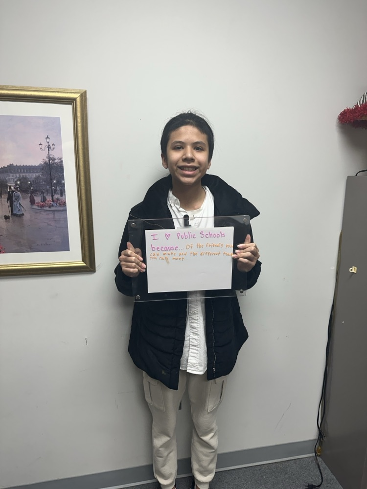 boy holding white board