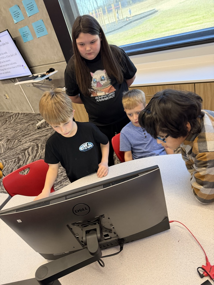 students in stem lab learning together and working together