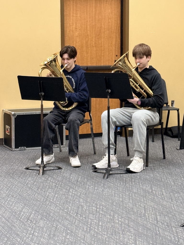 Students playing in an ensemble for a judge