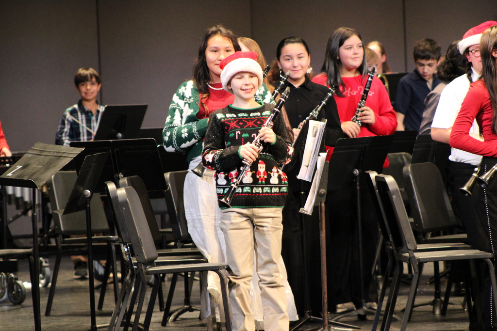 6th Grade student smiling after playing his first concert