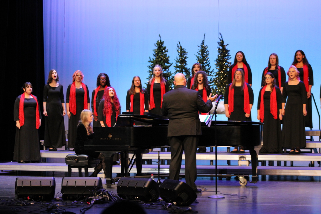 CHS Women's Choir in black dresses with red scarfs 