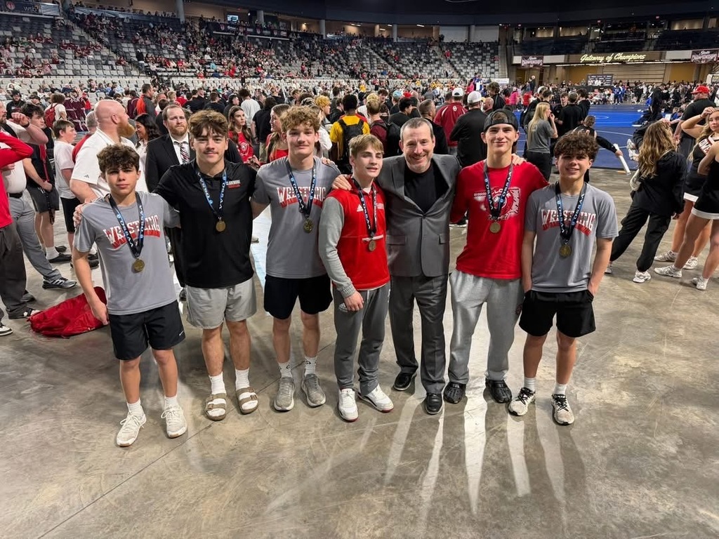 wrestlers with state medals and coach 