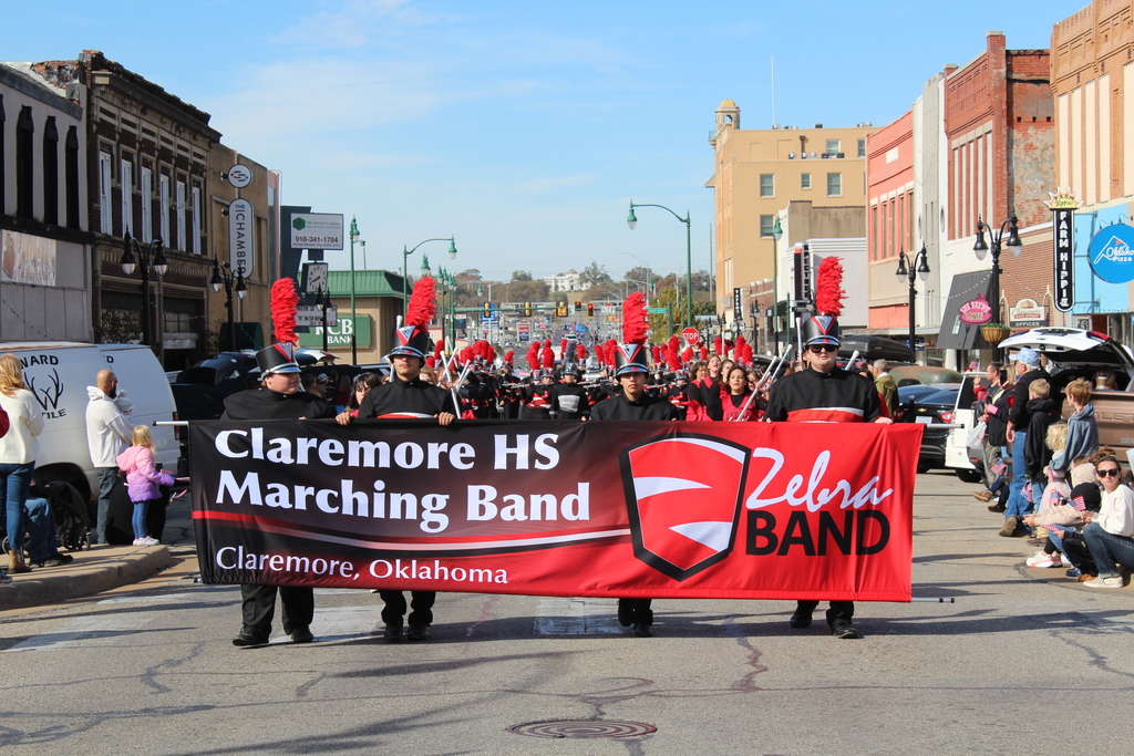 CHS Zebra Band marching in a parade in downtown Claremore.