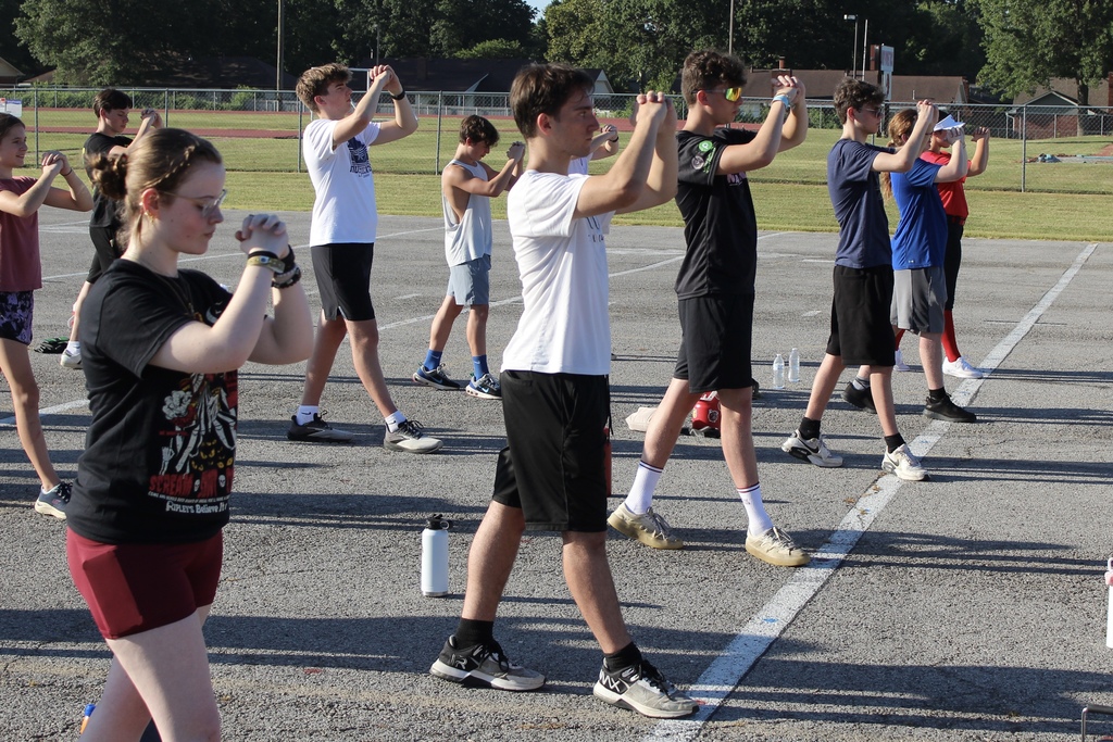 Students working on their marching skills on the lot behind the pac
