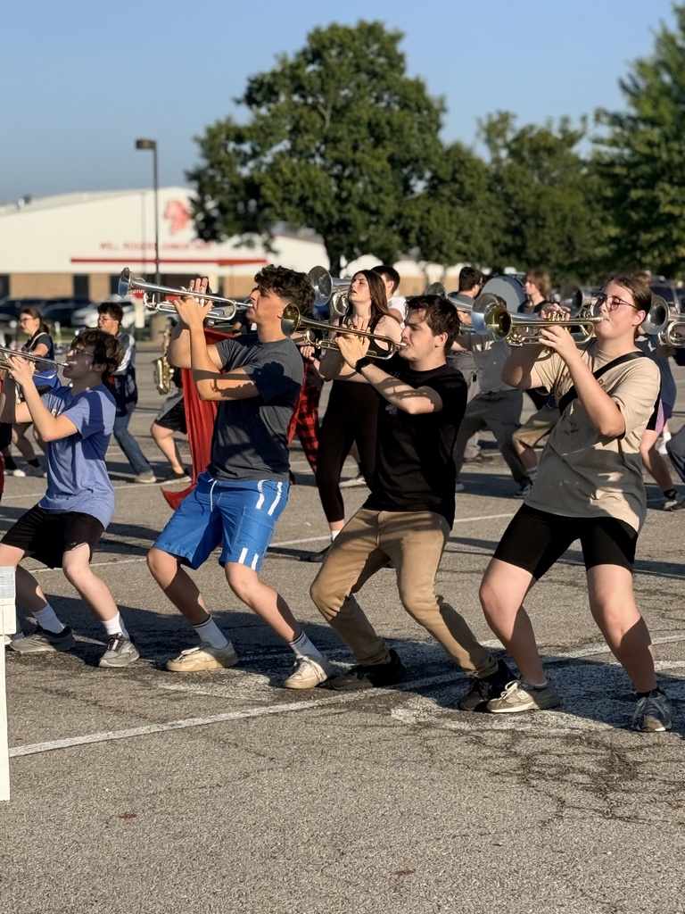 Students in marching rehearsal on the back lot behind the PAC