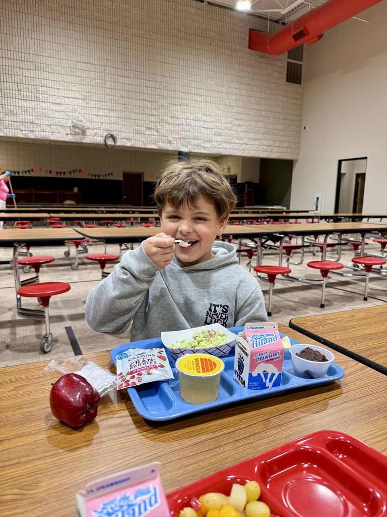 Student eating green eggs and ham