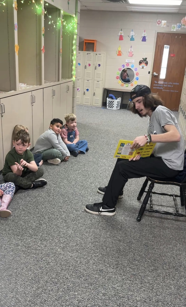 student from NE tech reading to students