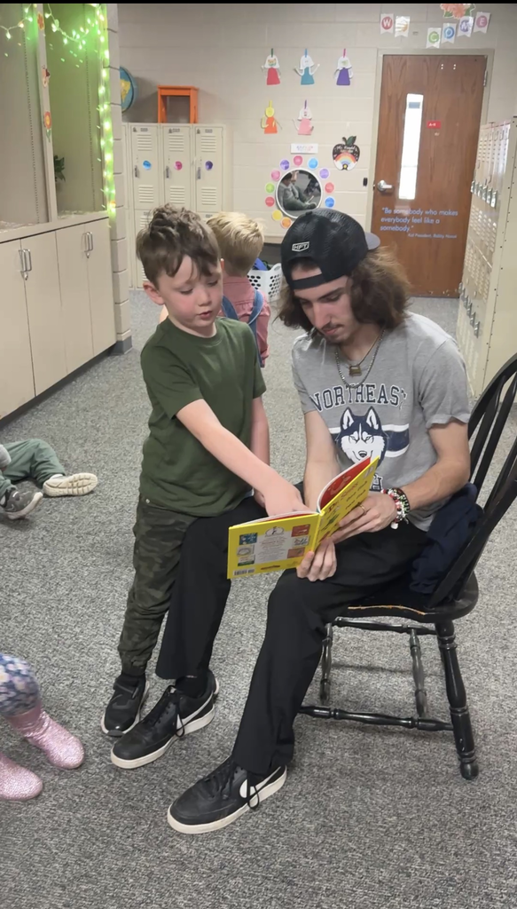 student from NE tech reading to students