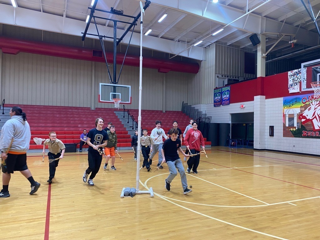 Junior high students learning and playing native american games.