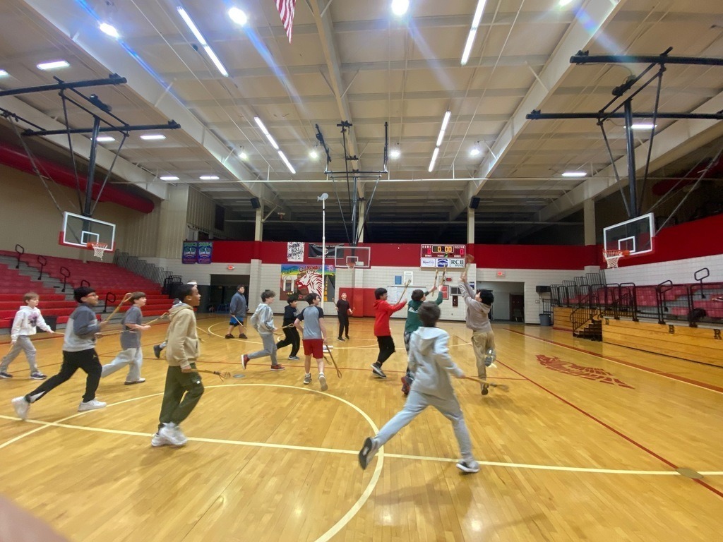 Junior high students learning and playing native american games.