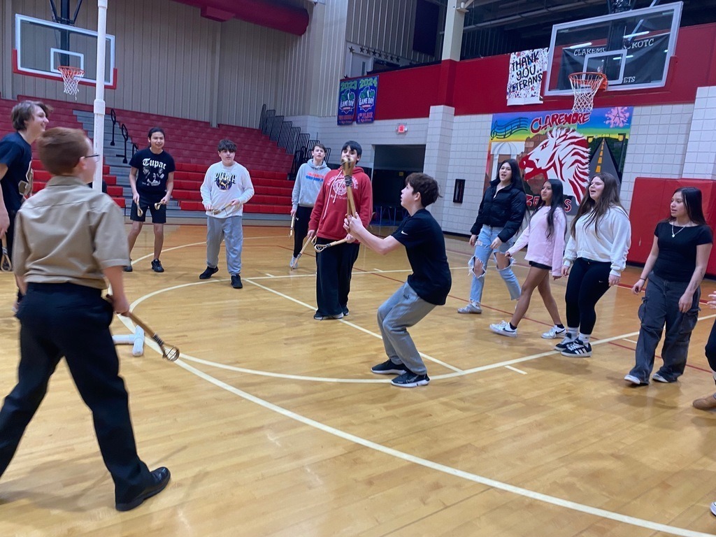 Junior high students learning and playing native american games.