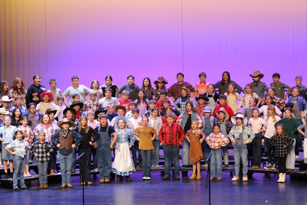 Roosa students on stage performing "Go West" the musical.