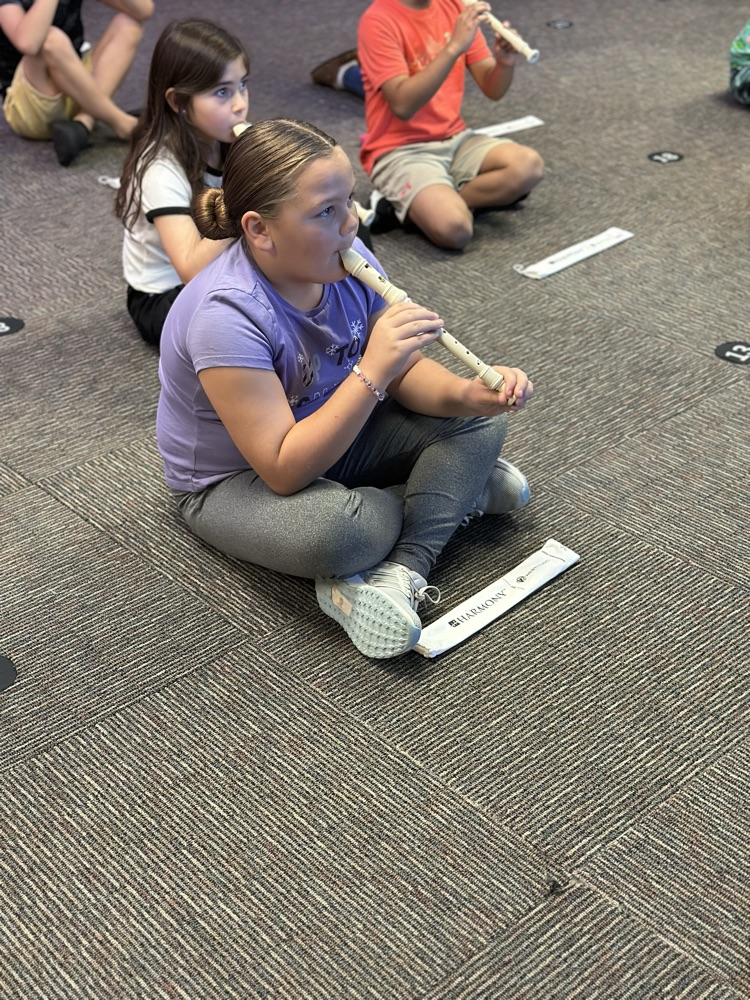 Students playing the recorder in music class