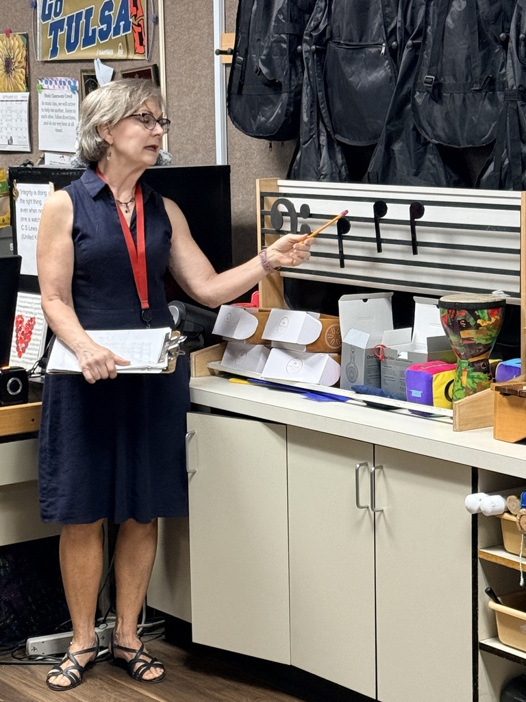 Mrs. Keener teaching a lesson about music notes on the scale