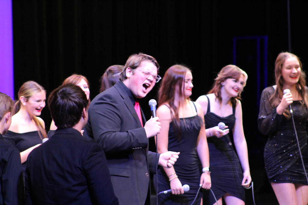 Student singing on stage in Room 701 Vocal Jazz