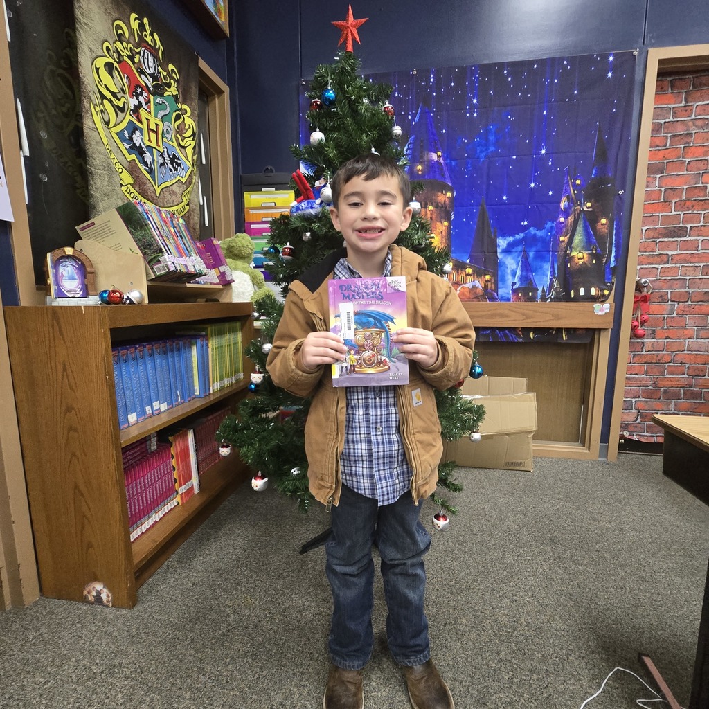 student holding book