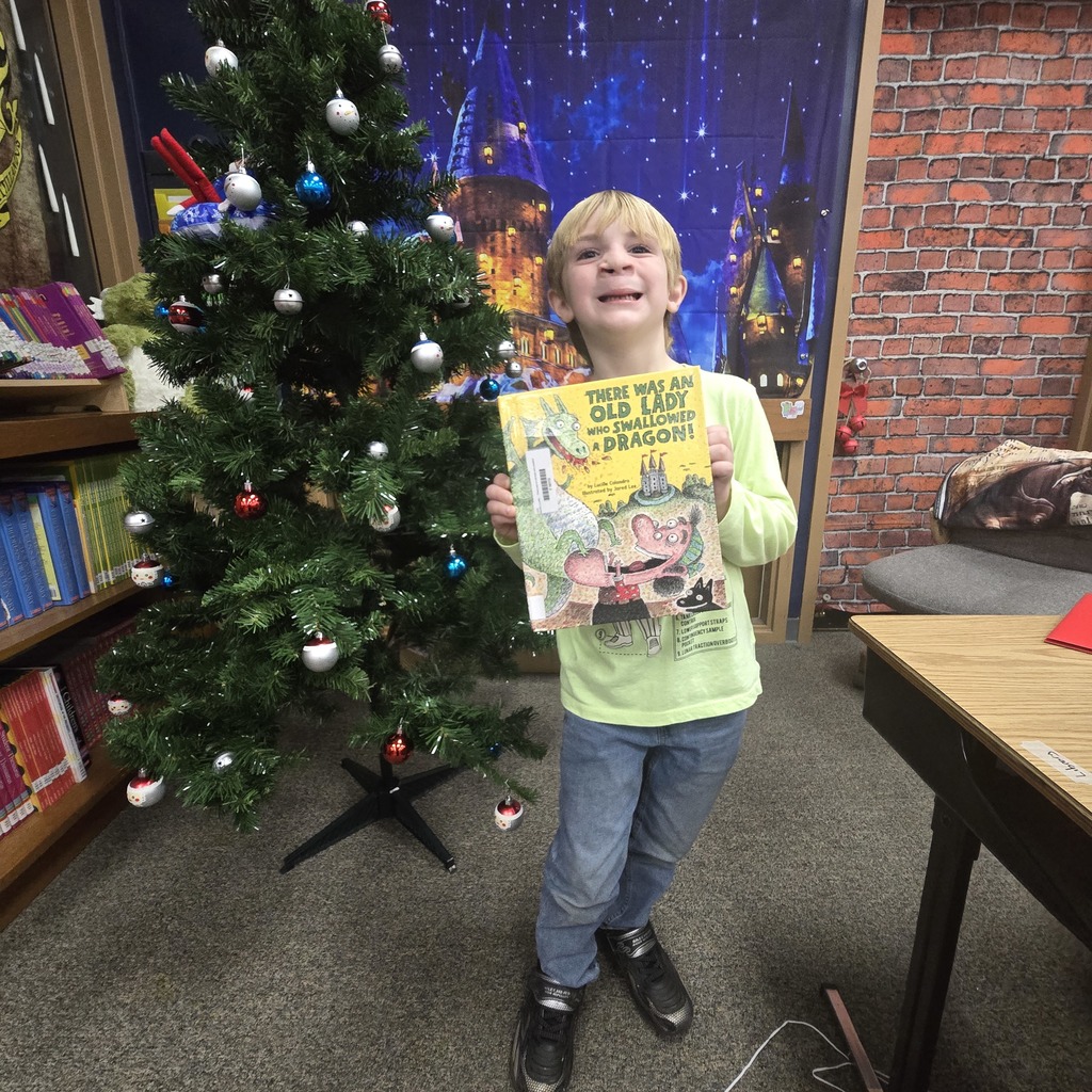 student holding book