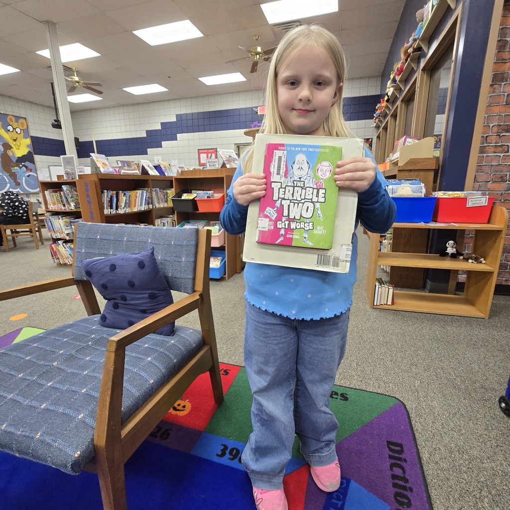 student holding book