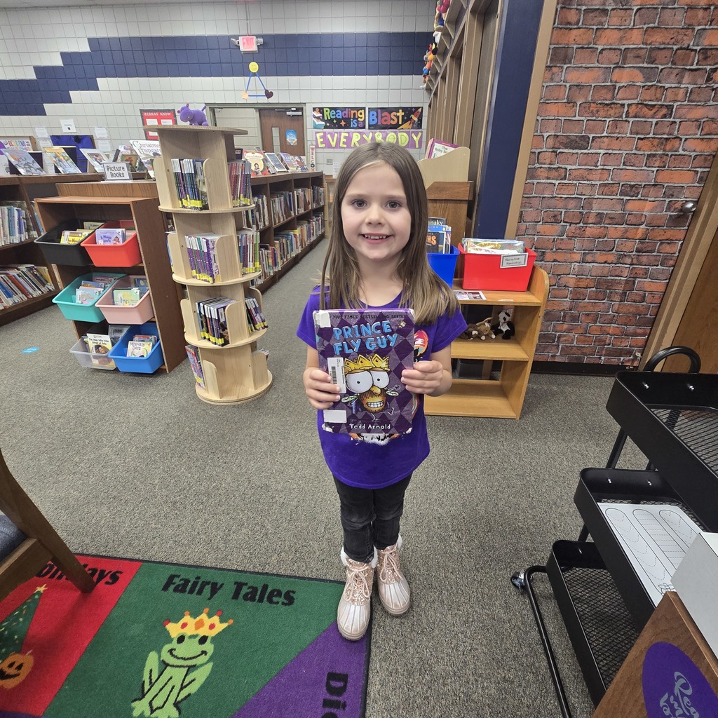 student holding book