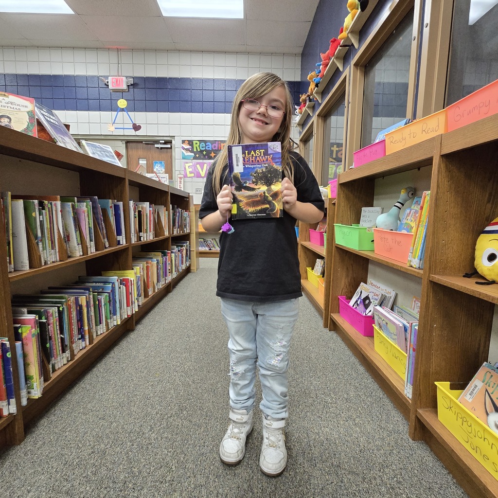 student holding book