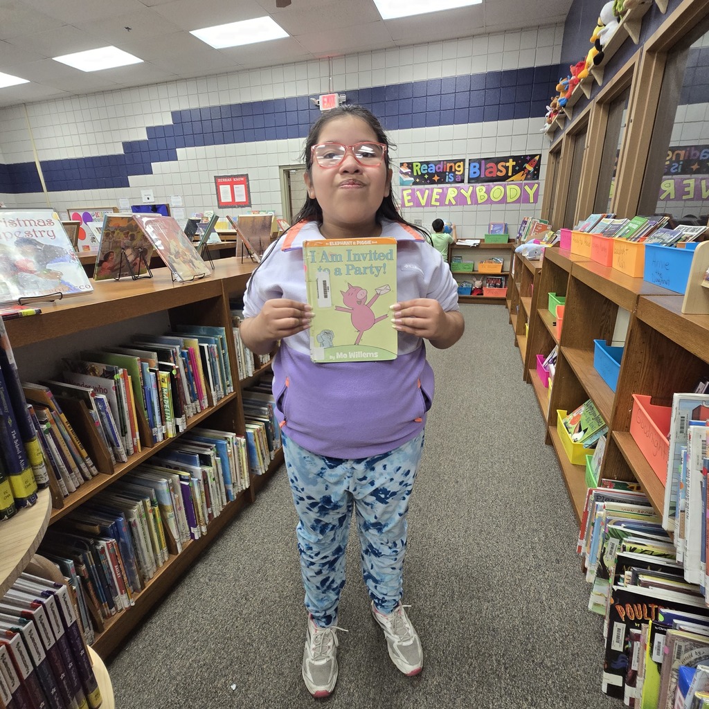 student holding book