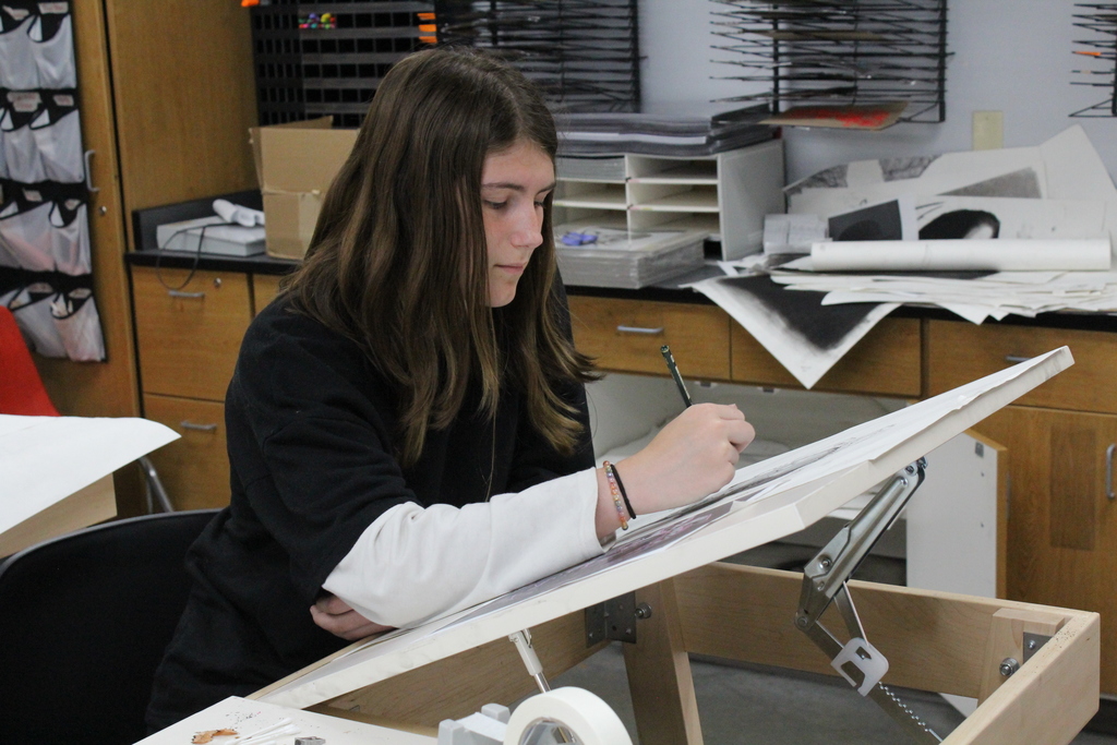 Student working hard in Art class