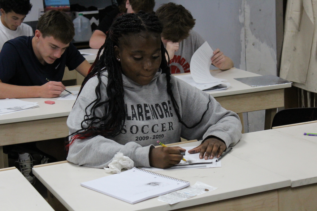 Student working in art class