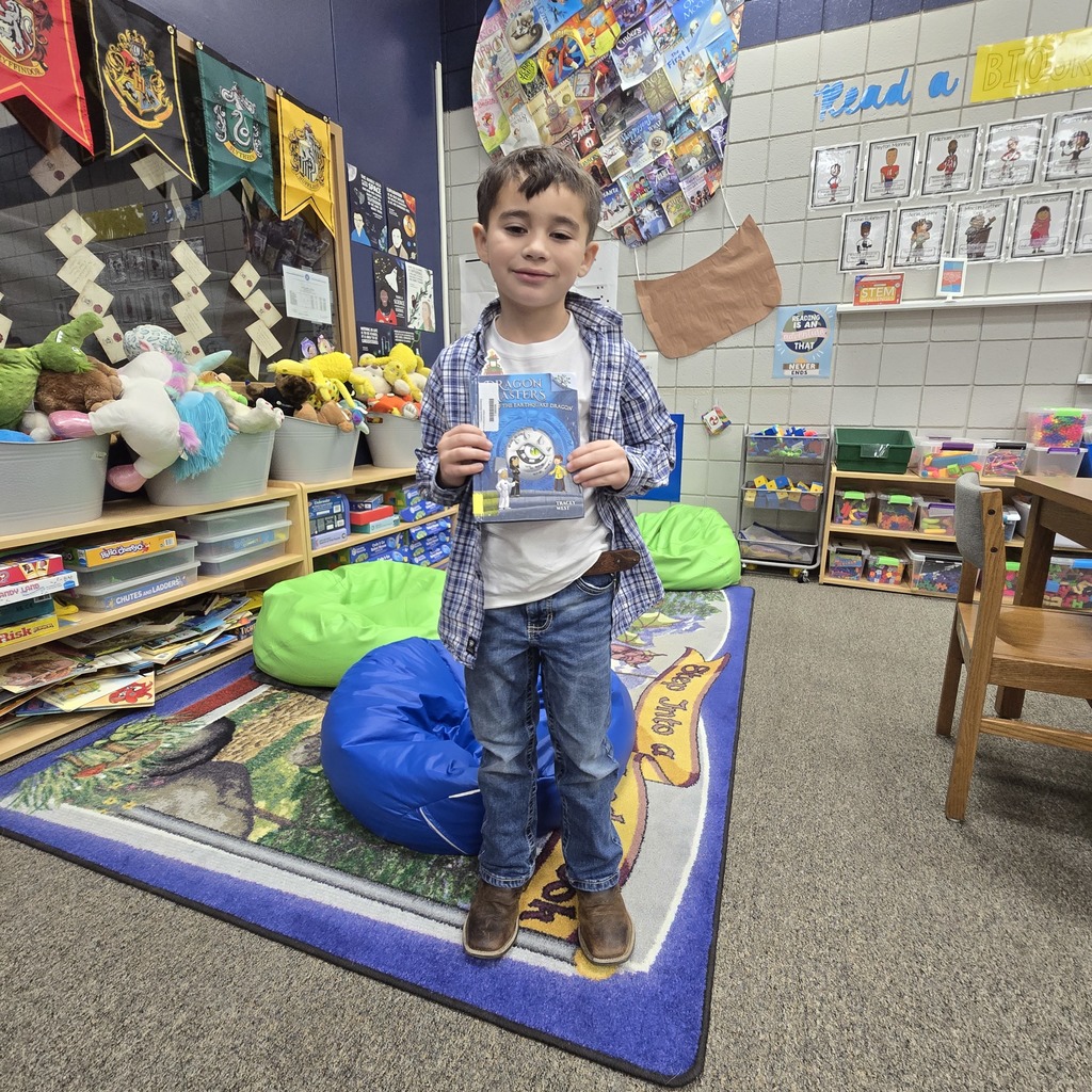 student holding book