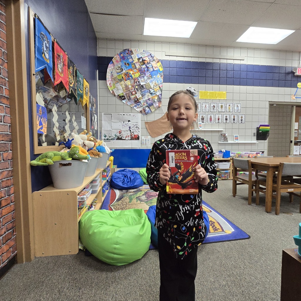 student holding book