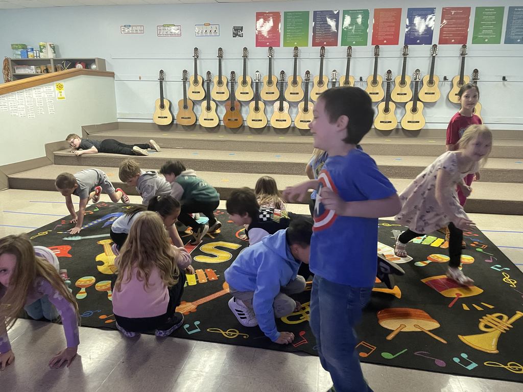 Students jumping around and dancing as they figure out the different tempo's in music class