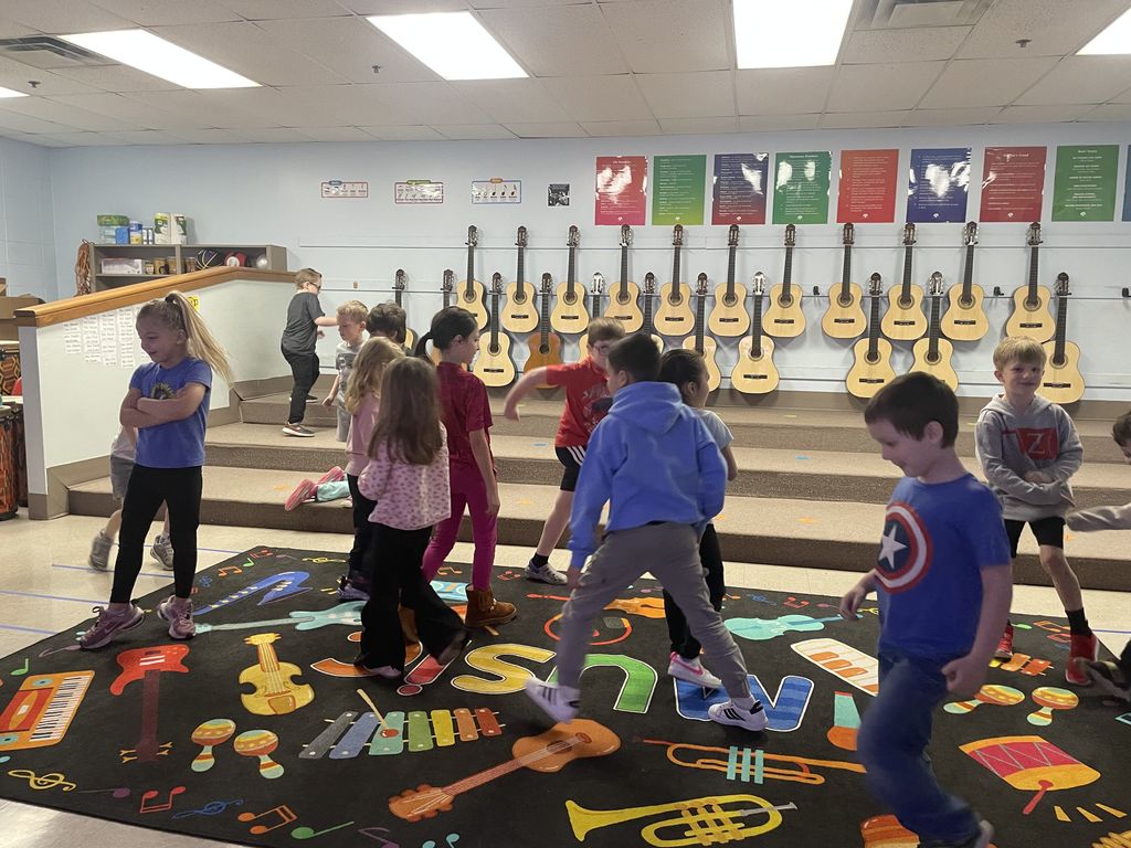 Students acting out the tempo to a song.