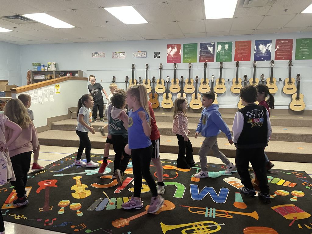 Students dancing in the music room while learning about tempo