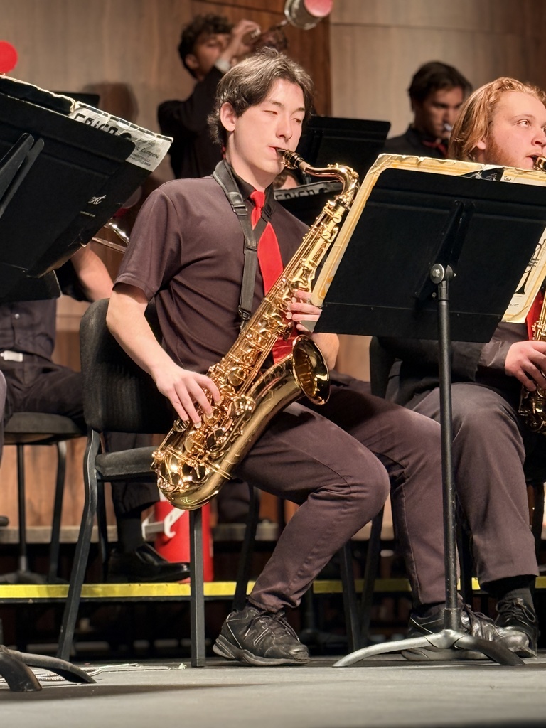 Student playing saxophone in the jazz band