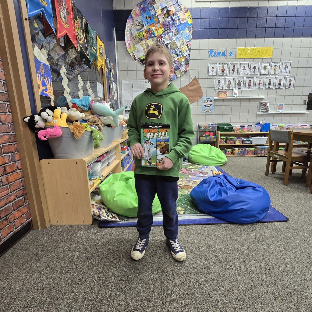student holding book