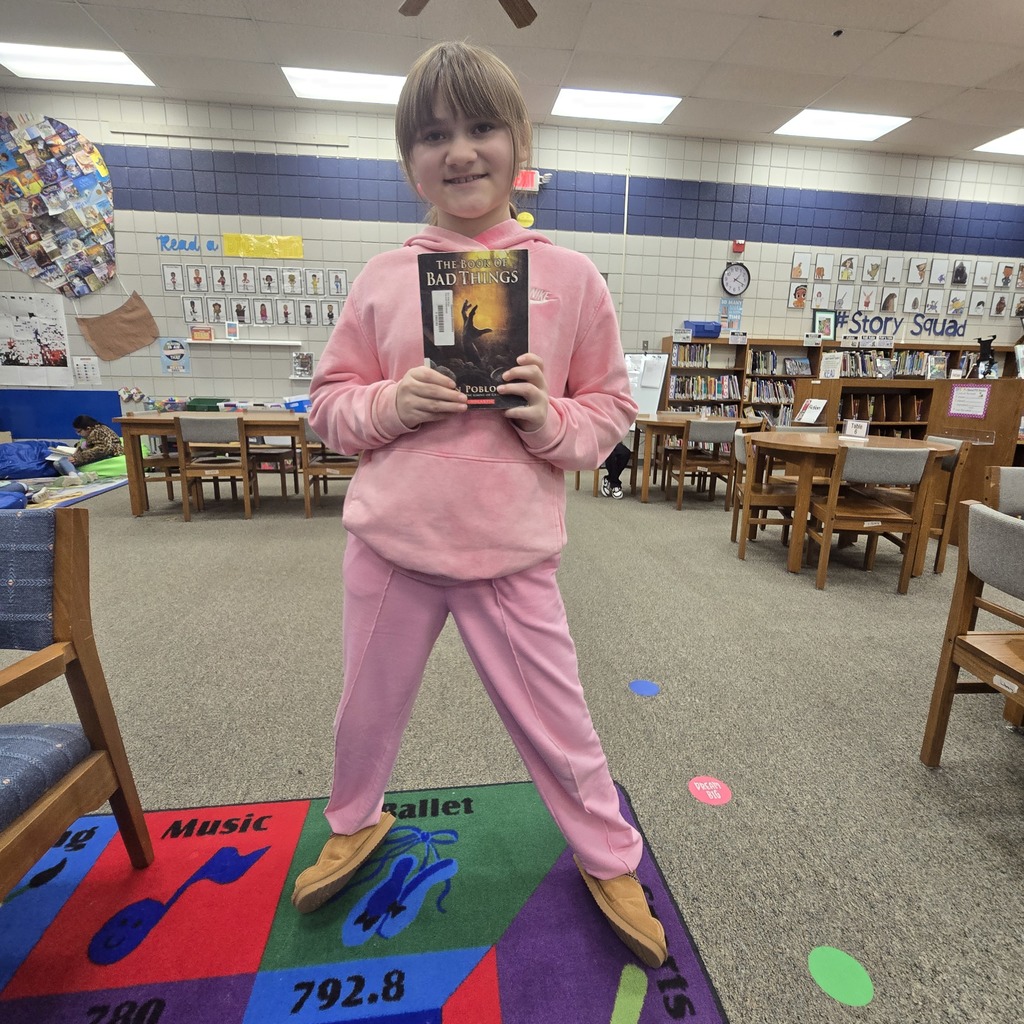 student holding book