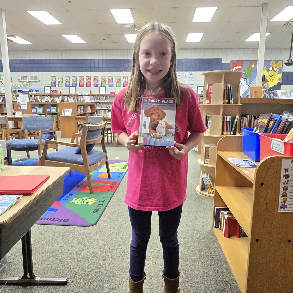 student holding book