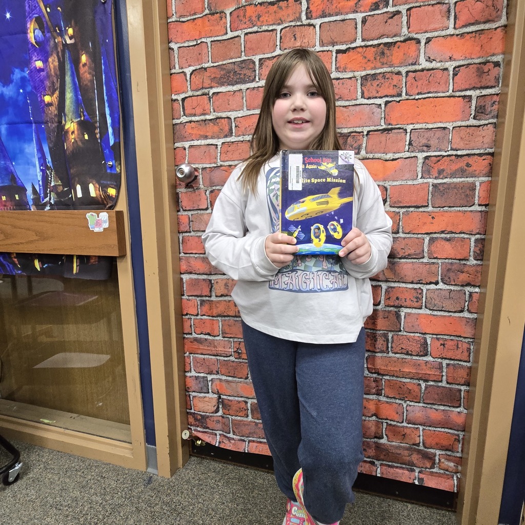 student holding book