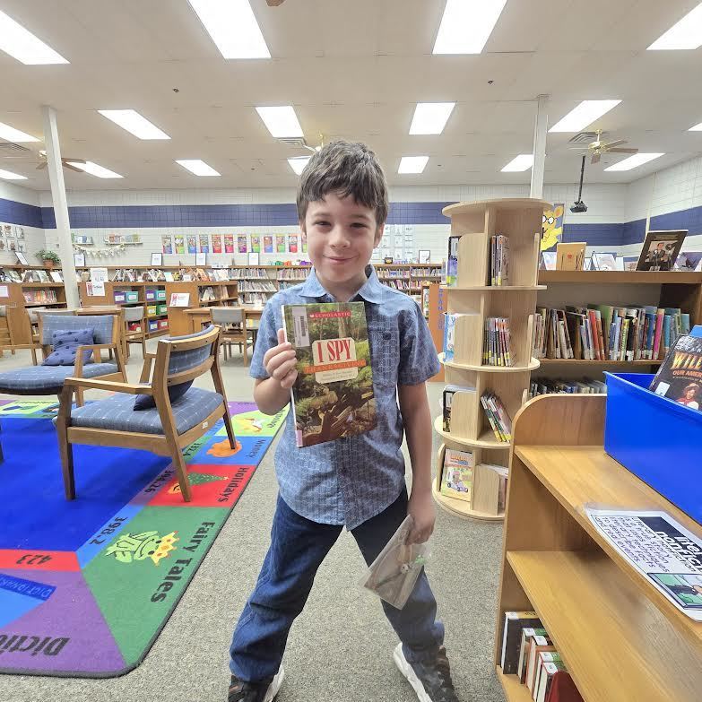 student holding book