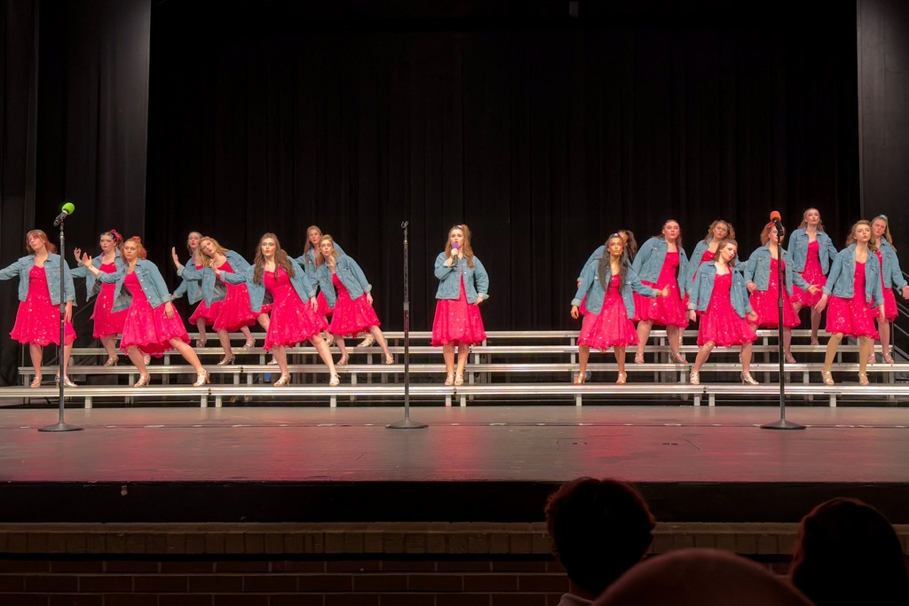 Sound Express on stage in their show choir performance.