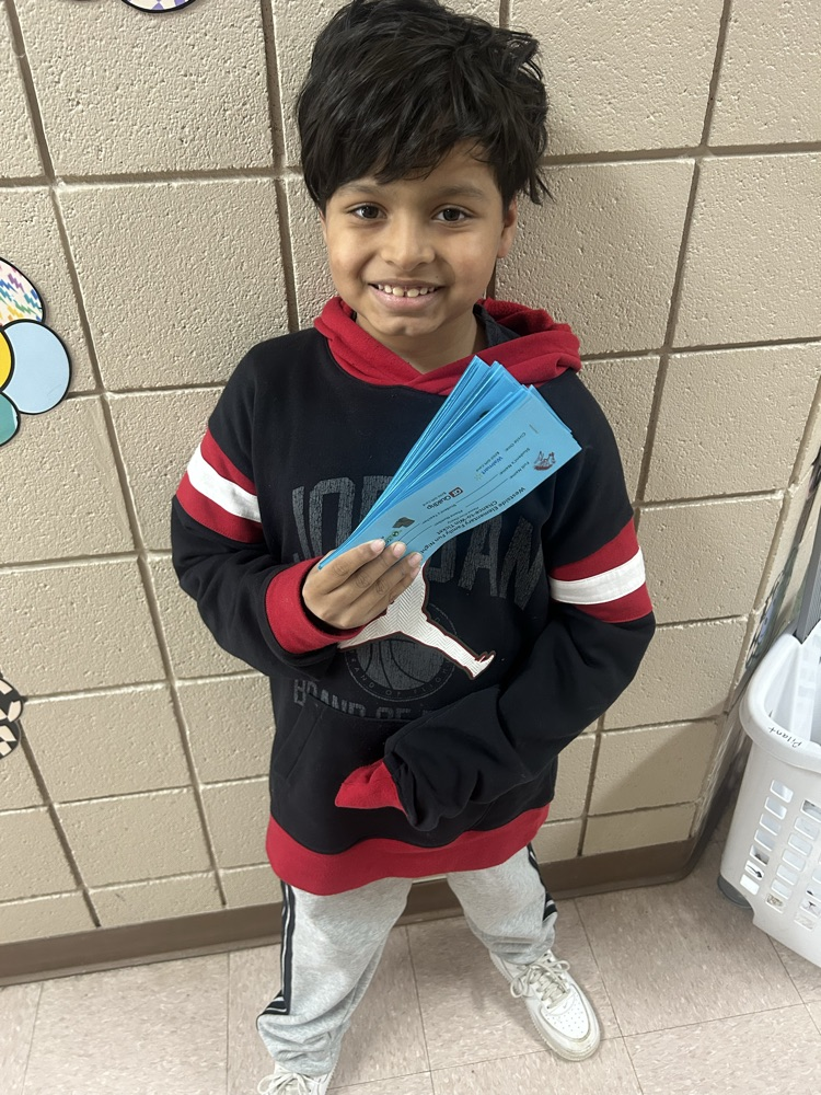 studen holding raffle tickets