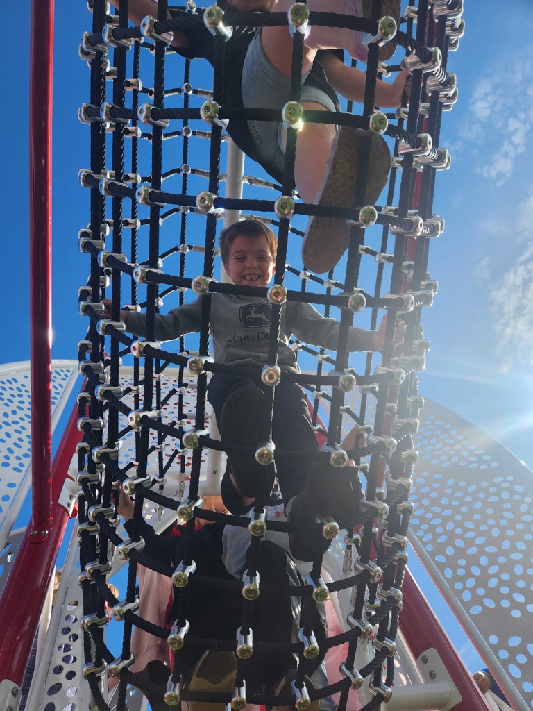student playing on new playground
