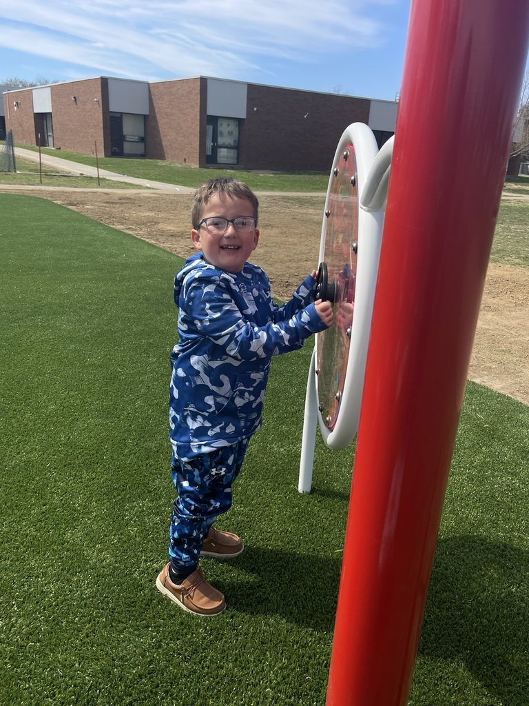 student playing on new playground