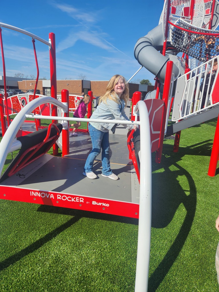 student playing on new playground