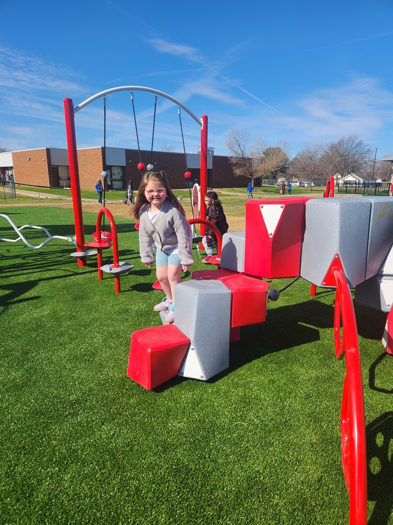 student playing on new playground