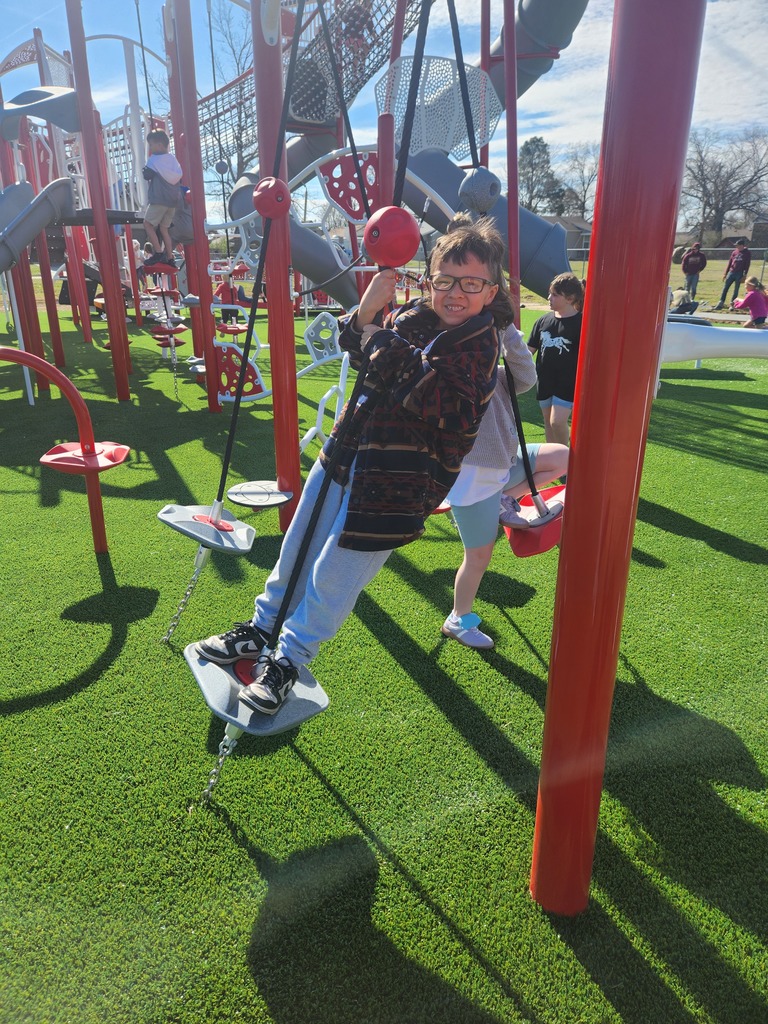 student playing on new playground