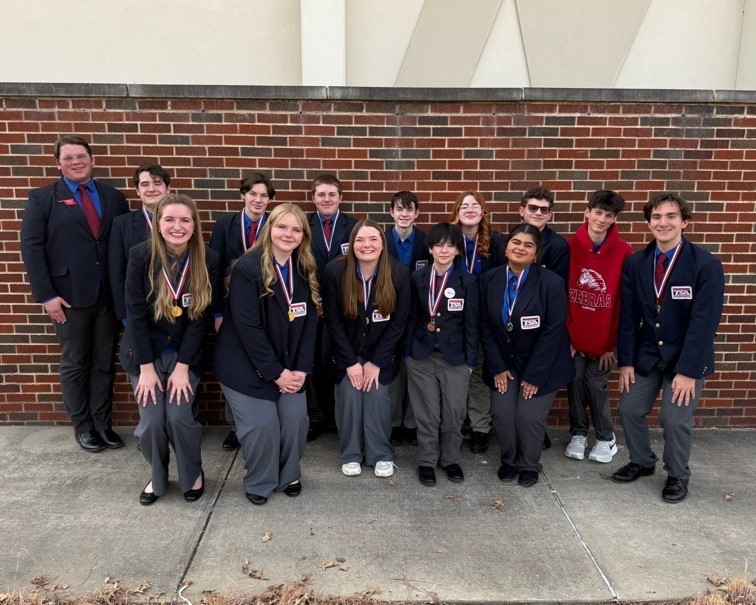 tsa students with their medals