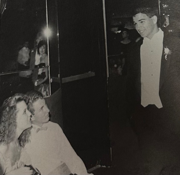 boy talking to two girls 