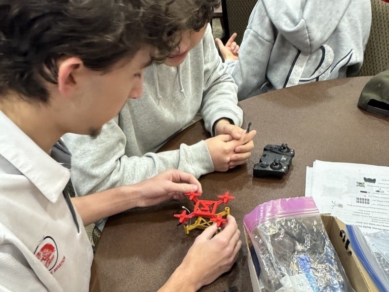 Claremore high school Aeronautics students working on drones.