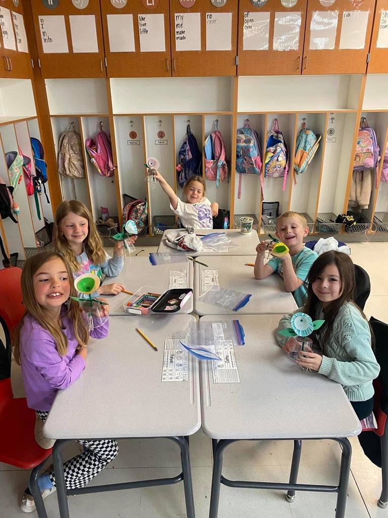 elementary students learning about gardening.